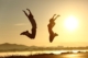 man and woman jumping